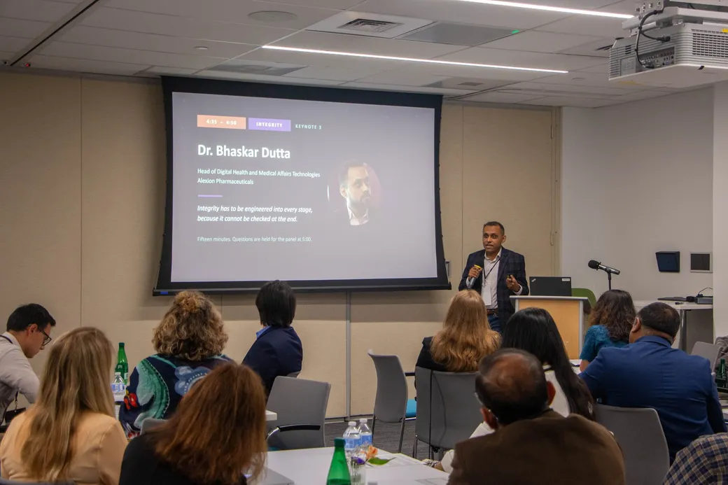 Dr. Bhaskar Dutta speaking beside his Integrity keynote card.