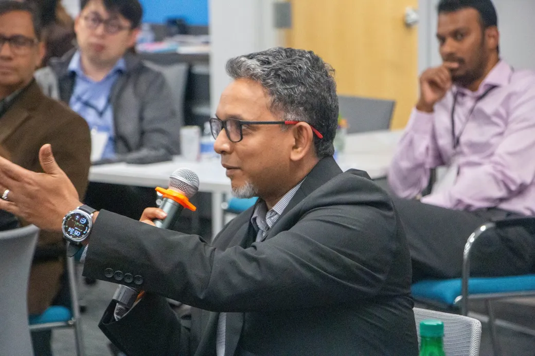 A guest speaking into a microphone during the audience block.