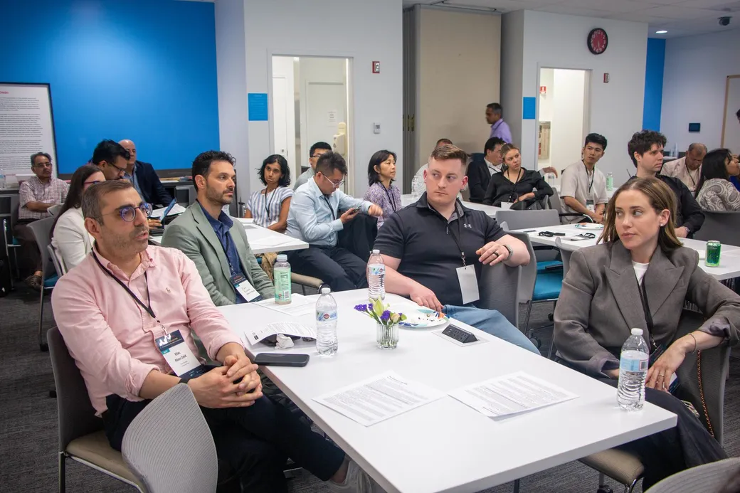 The room of attendees engaged in the discussion
